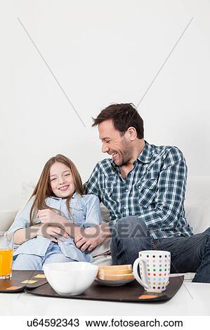 Father tickling to his daughter View Large Photo Image Stock Image - Father tickling to his daughter. Fotosearch