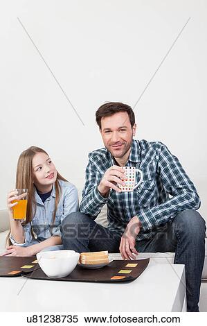 Father with his daughter having a brakfast View Large Photo Image Stock Photography - Father with his daughter having a brakfast. Fotosearch
