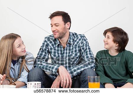 Father with his sons View Large Photo Image Picture - Father with his sons. Fotosearch