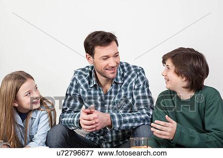 Father with his sons View Large Photo Image Stock Photo - Father with his sons. Fotosearch