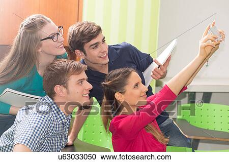 Friends in the college with a smartphone View Large Photo Image Stock Image - Friends in the college with a smartphone. Fotosearch
