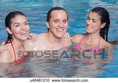 Stock Image - Friends in the pool. Fotosearch