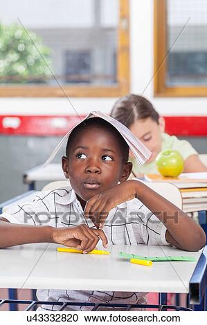 Stock Image - funny black boy in the school. Fotosearch
