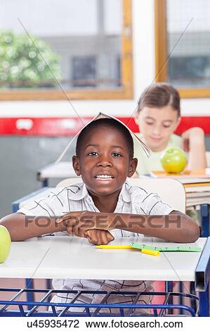 Funny black boy in the school View Large Photo Image Stock Image - Funny black boy in the school. Fotosearch
