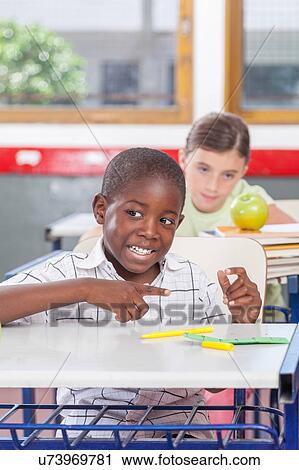 Stock Image - funny black boy in the school. Fotosearch