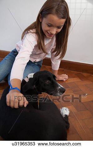 Girl and dog on floor View Large Photo Image Stock Image - Girl and dog on floor. Fotosearch