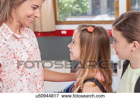 girl arriving at school View Large Photo Image Stock Photo - girl arriving at school. Fotosearch