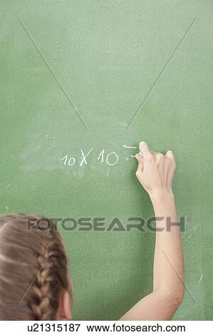 Stock Photo - Girl doing an excercise of math. Fotosearch