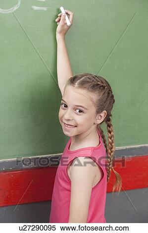 Stock Photography - Girl doing an excercise of math. Fotosearch