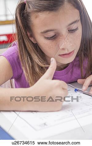 Girl doing the exercise of math View Large Photo Image Stock Photography - Girl doing the exercise of math. Fotosearch