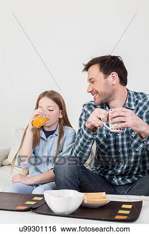 Stock Photograph - Girl drinking juice . Fotosearch