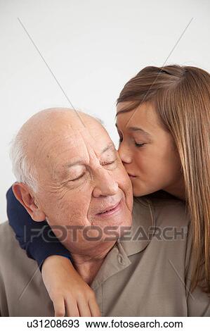 Stock Image - girl having fun with her grandfather. Fotosearch