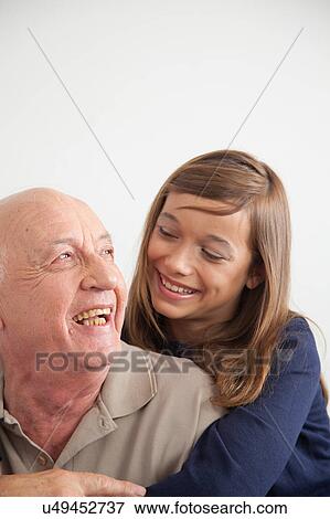 Stock Photo - girl having fun with her grandfather. Fotosearch