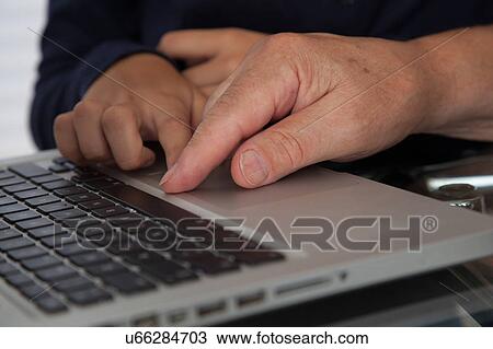 Girl helping to her grandfather with the computer View Large Photo Image Stock Image - Girl helping to her grandfather with the computer. Fotosearch