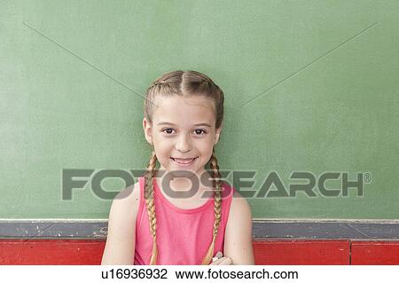 Stock Image - Girl looking at camera. Fotosearch