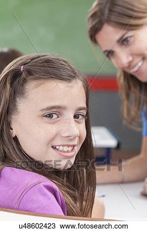 Girl looking at camera View Large Photo Image Stock Image - Girl looking at camera. Fotosearch