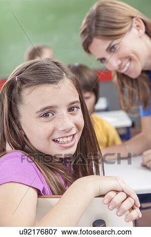 Stock Photo - Girl looking at camera. Fotosearch