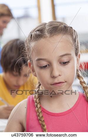 Girl looking down View Large Photo Image Stock Photograph - Girl looking down. Fotosearch