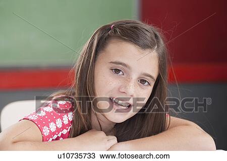 Girl reading at school View Large Photo Image Stock Image - Girl reading at school. Fotosearch
