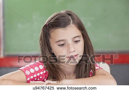 Girl reading at school View Large Photo Image Stock Photography - Girl reading at school. Fotosearch