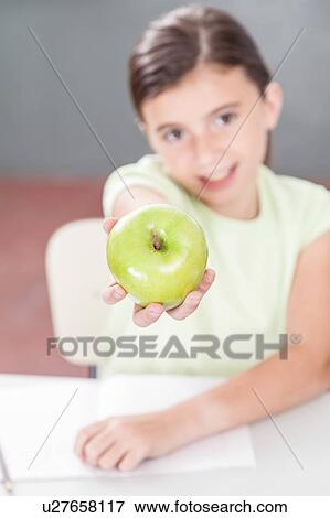 Stock Photo - Girl sharing a apple. Fotosearch