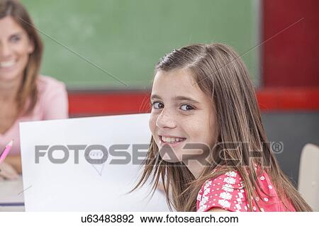 Girl showing her draw View Large Photo Image Stock Image - Girl showing her draw. Fotosearch