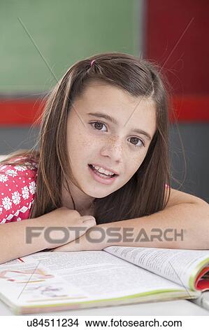 Picture - Girl smiling and looking at camera. Fotosearch