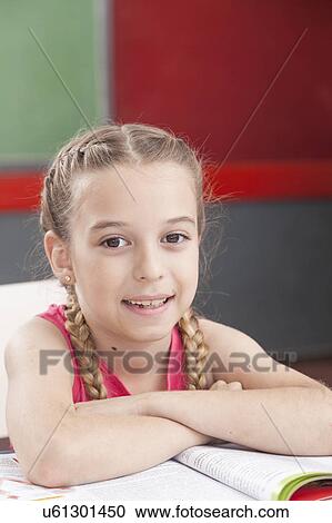 Girl smiling and looking at camera View Large Photo Image Stock Image - Girl smiling and looking at camera. Fotosearch