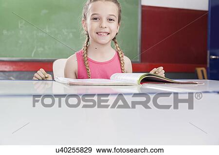 Girl smiling and looking at camera View Large Photo Image Stock Photo - Girl smiling and looking at camera. Fotosearch
