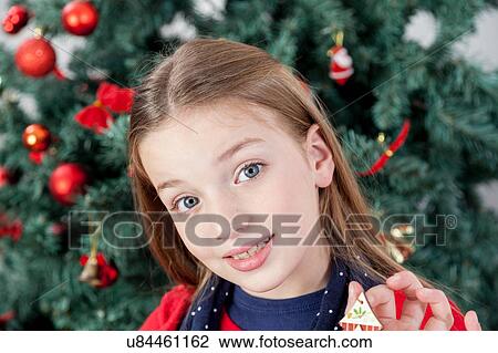 Stock Image - Girl smiling looking at the camera. Fotosearch