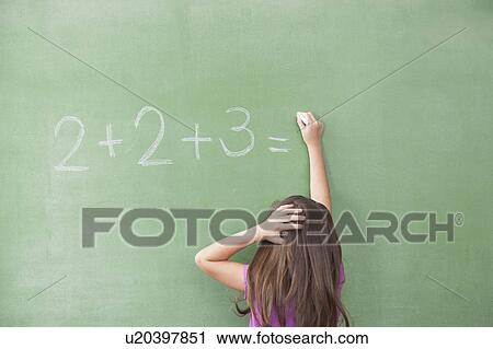 Stock Image - Girl trying do an excercise of math. Fotosearch