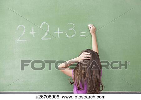 Stock Photograph - Girl trying do an excercise of math. Fotosearch