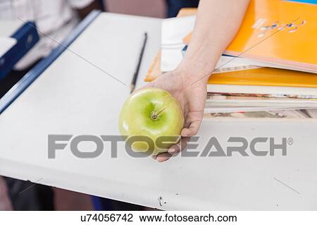 Stock Image - Girl with text books. Fotosearch