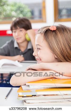 Girl with text books View Large Photo Image Stock Photo - Girl with text books. Fotosearch