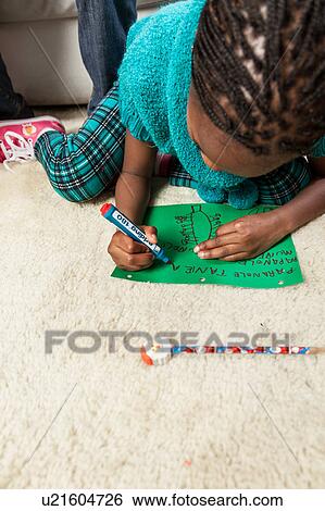 Stock Photograph - Girl writing letter to Santa. Fotosearch