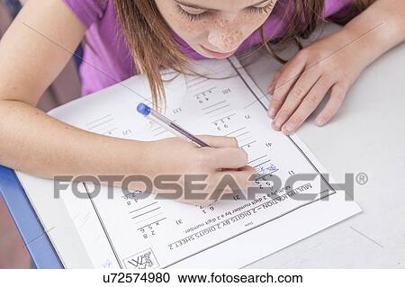 Stock Image - Girl writing. Fotosearch