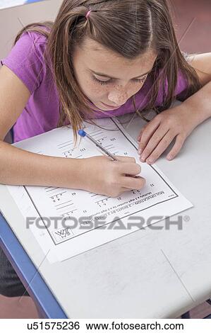 Stock Photograph - Girl writing. Fotosearch