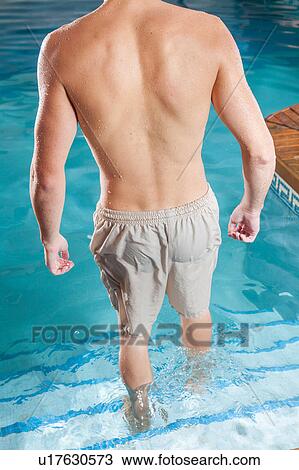 Stock Image - Guy back enter the pool. Fotosearch