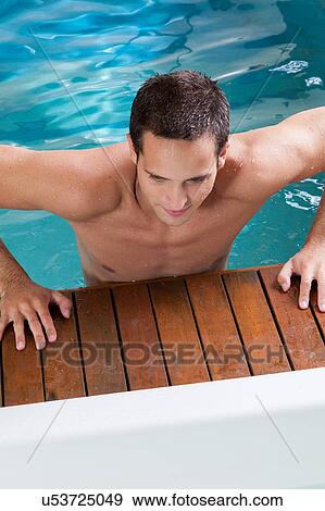 Guy coming out of the pool View Large Photo Image Stock Photo - Guy coming out of the pool. Fotosearch
