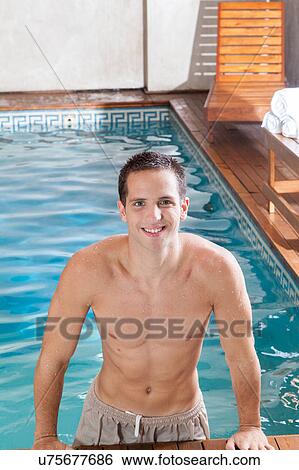 Guy coming out of the pool View Large Photo Image Stock Photograph - Guy coming out of the pool. Fotosearch