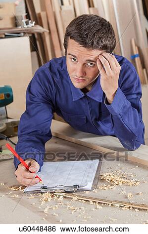 Guy holding his head View Large Photo Image Stock Photograph - Guy holding his head. Fotosearch