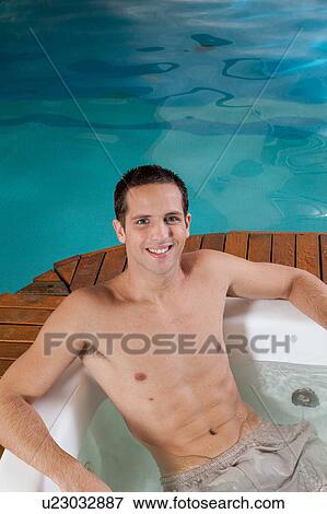 Stock Photo - Guy inside a jacuzzi. Fotosearch