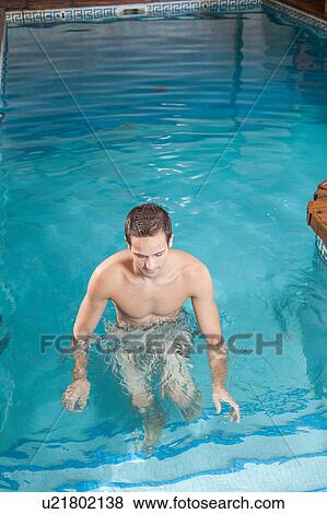 Stock Photo - Guy out of the pool. Fotosearch
