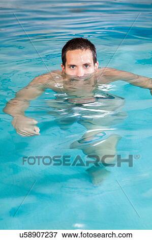 Stock Photo - Guy out of the pool. Fotosearch