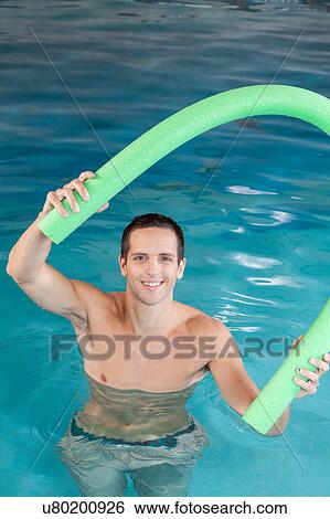 Guy playing with a float View Large Photo Image Stock Photograph - Guy playing with a float. Fotosearch