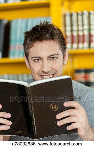 Stock Photograph - Guy reading a book. Fotosearch