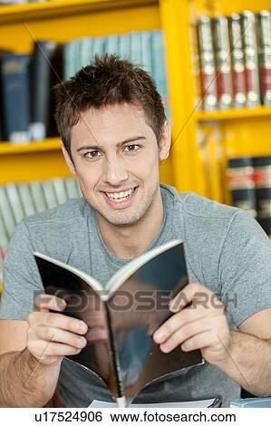 Stock Photograph - Guy studying. Fotosearch