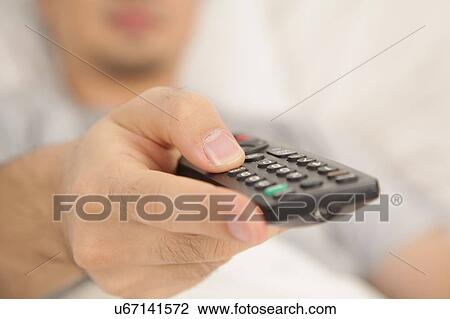 Stock Image - Hand holding control. Fotosearch