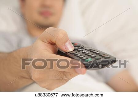 Hand holding control View Large Photo Image Stock Photo - Hand holding control. Fotosearch