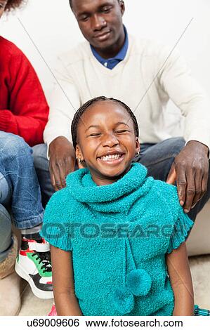 Happy black girl in christmas View Large Photo Image Stock Photograph - Happy black girl in christmas. Fotosearch